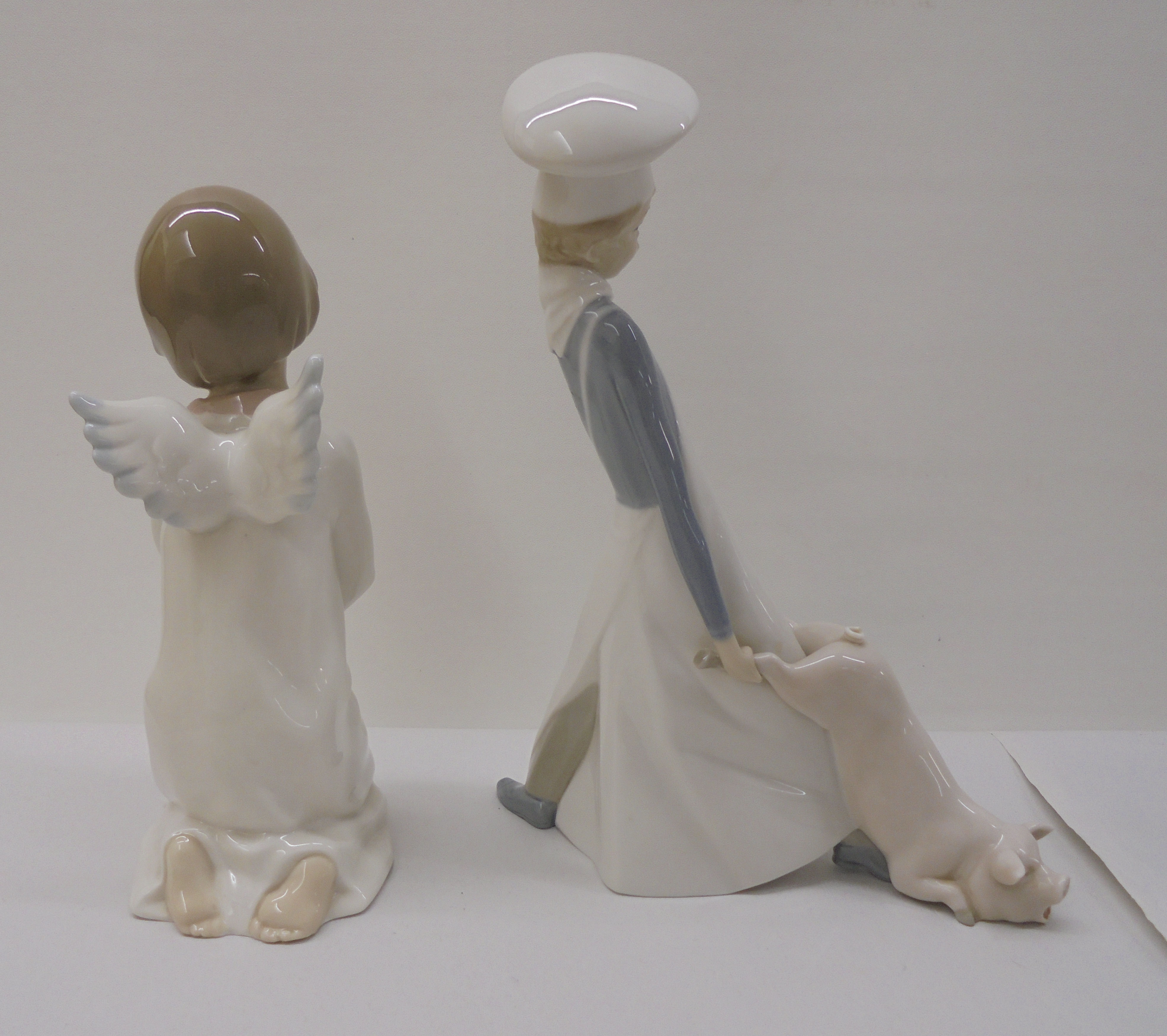 Three Lladro, three Nao and one Nadal porcelain figures: to include a seated angelic figure  4"h - Image 6 of 13