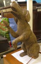 A carved seated wooden preforming dog  26"h