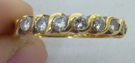 A 9ct gold diamond set half eternity ring