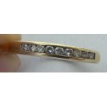 A 9ct gold and diamond set half eternity ring