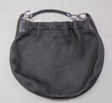 A Gucci black hide handbag  serial number 109210 2684