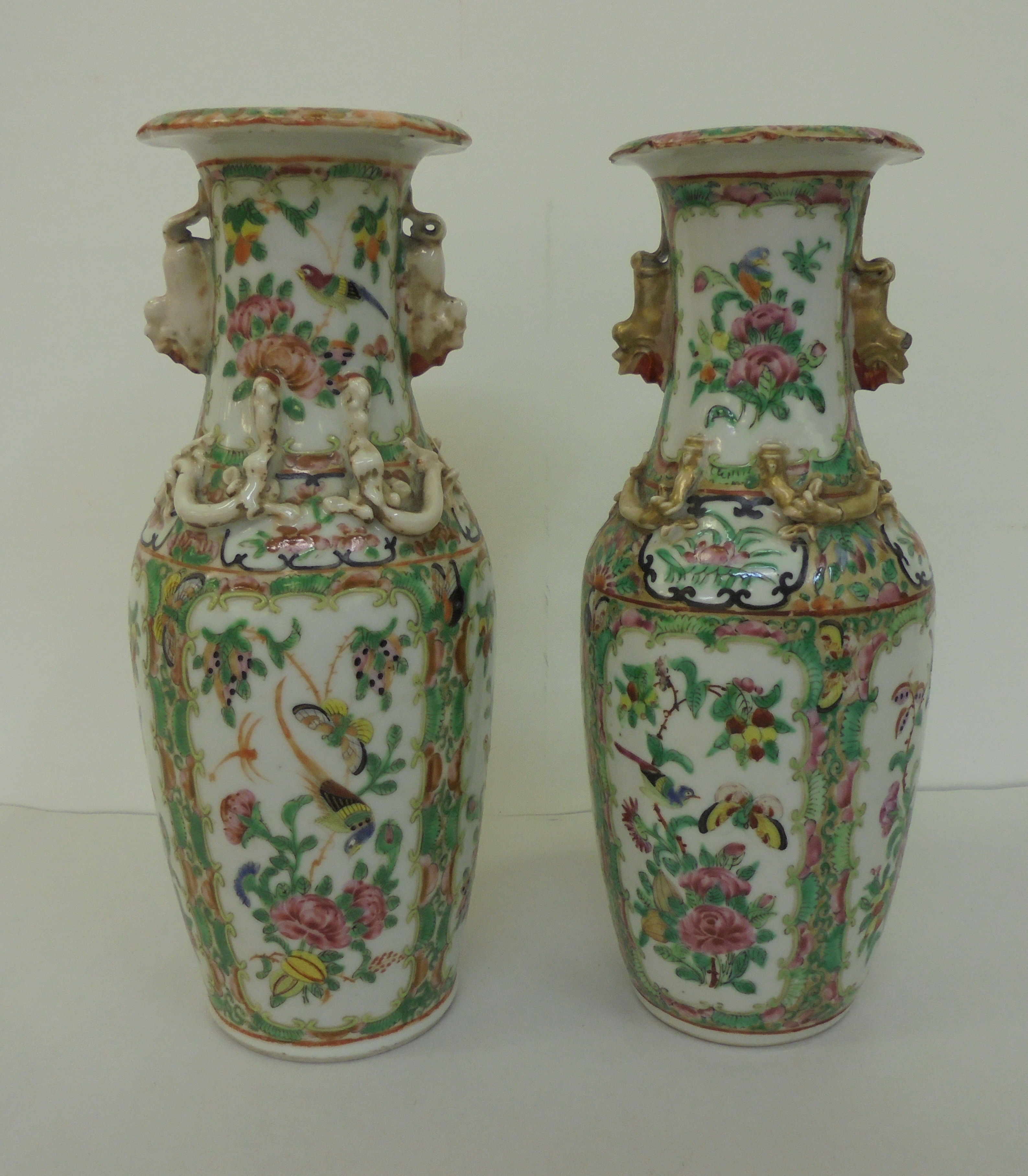 Two similar Chinese Canton Export porcelain vases with overlaid ornament, decorated in panels with