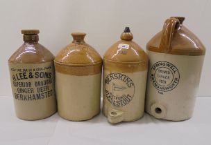 Four early/mid 20thC two tone brown stoneware flagons: to include Springhead of Rickmansworth and