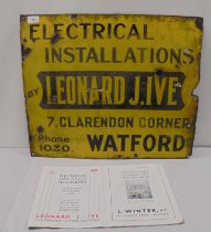 A vintage enamel cast metal advertising sign for 'Leonard J Ive Electrical Installations' black on