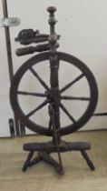 A late 19thC fruitwood spinning wheel with turned uprights  39"h
