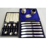 Silver tableware: to include a set of six bean terminal coffee spoons; and a wine label  mixed marks