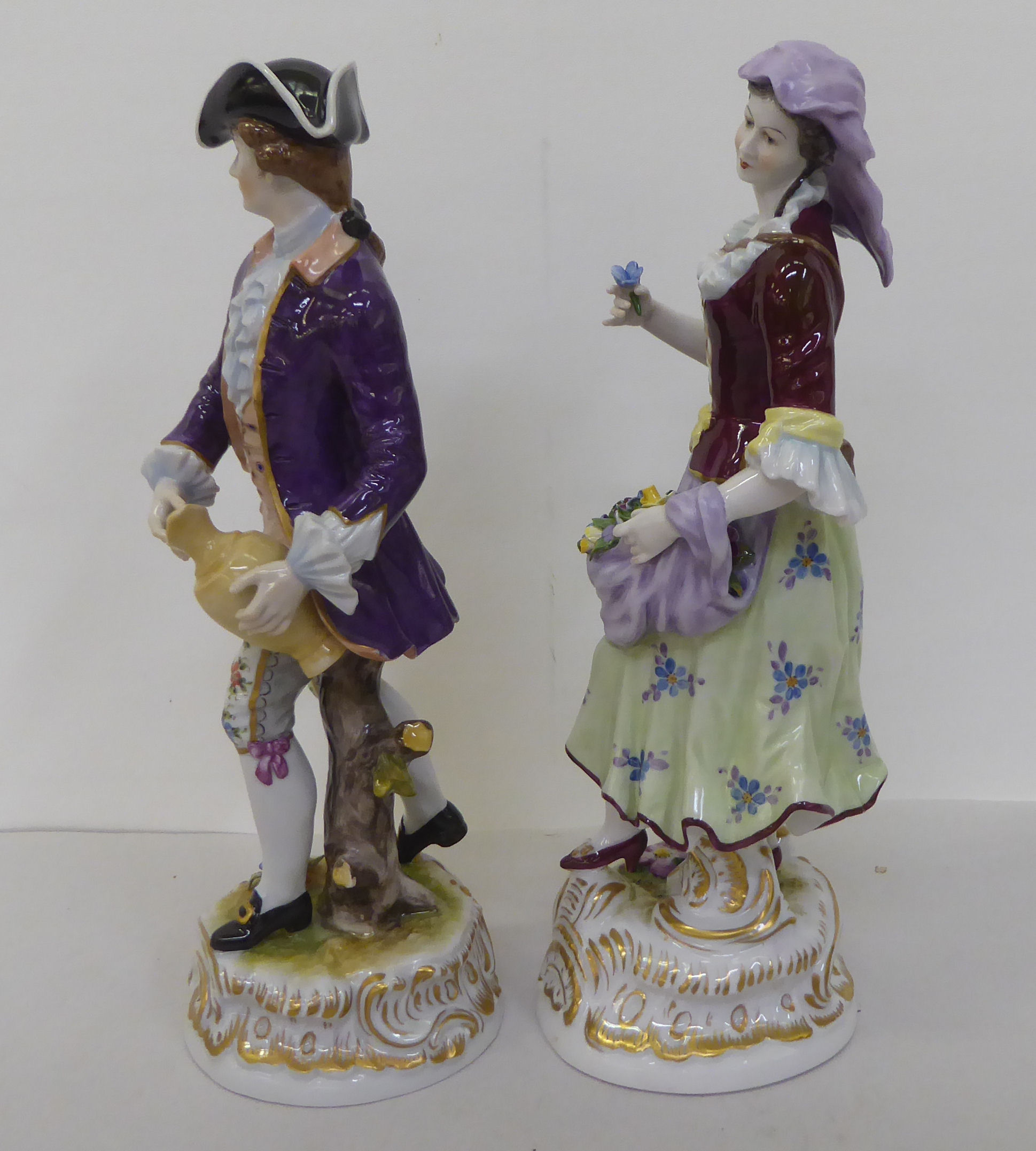 A pair of 20thC Continental porcelain figures, he wearing a tricorn hat and frockcoat, she with - Image 2 of 5