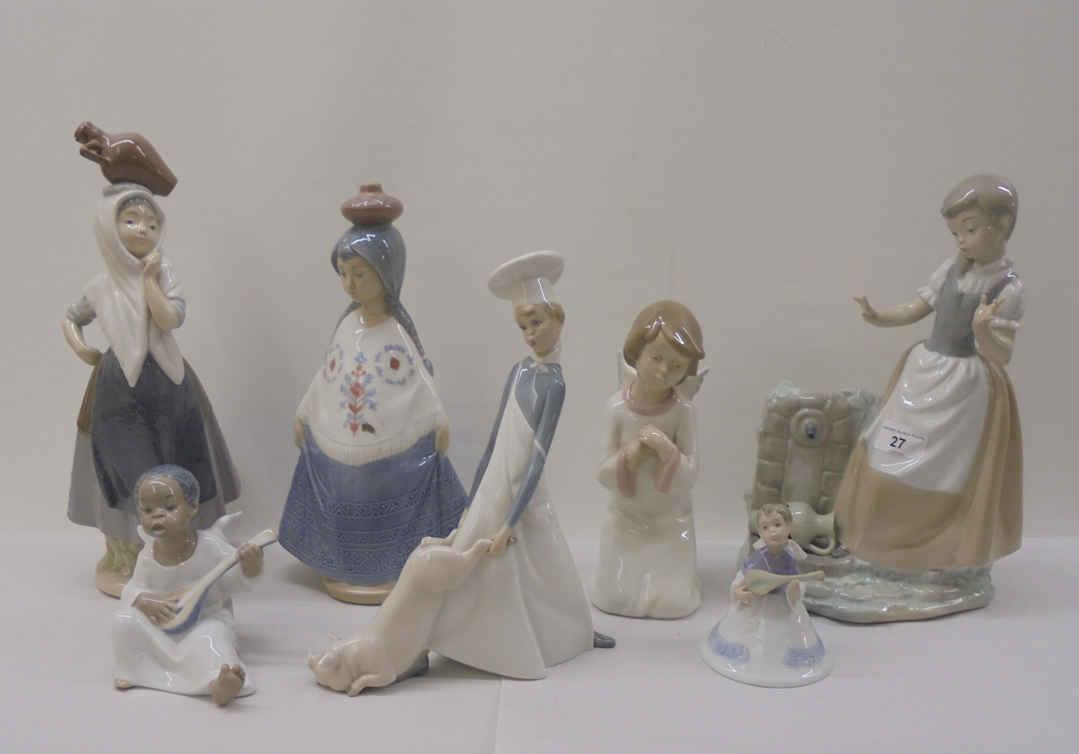 Three Lladro, three Nao and one Nadal porcelain figures: to include a seated angelic figure  4"h