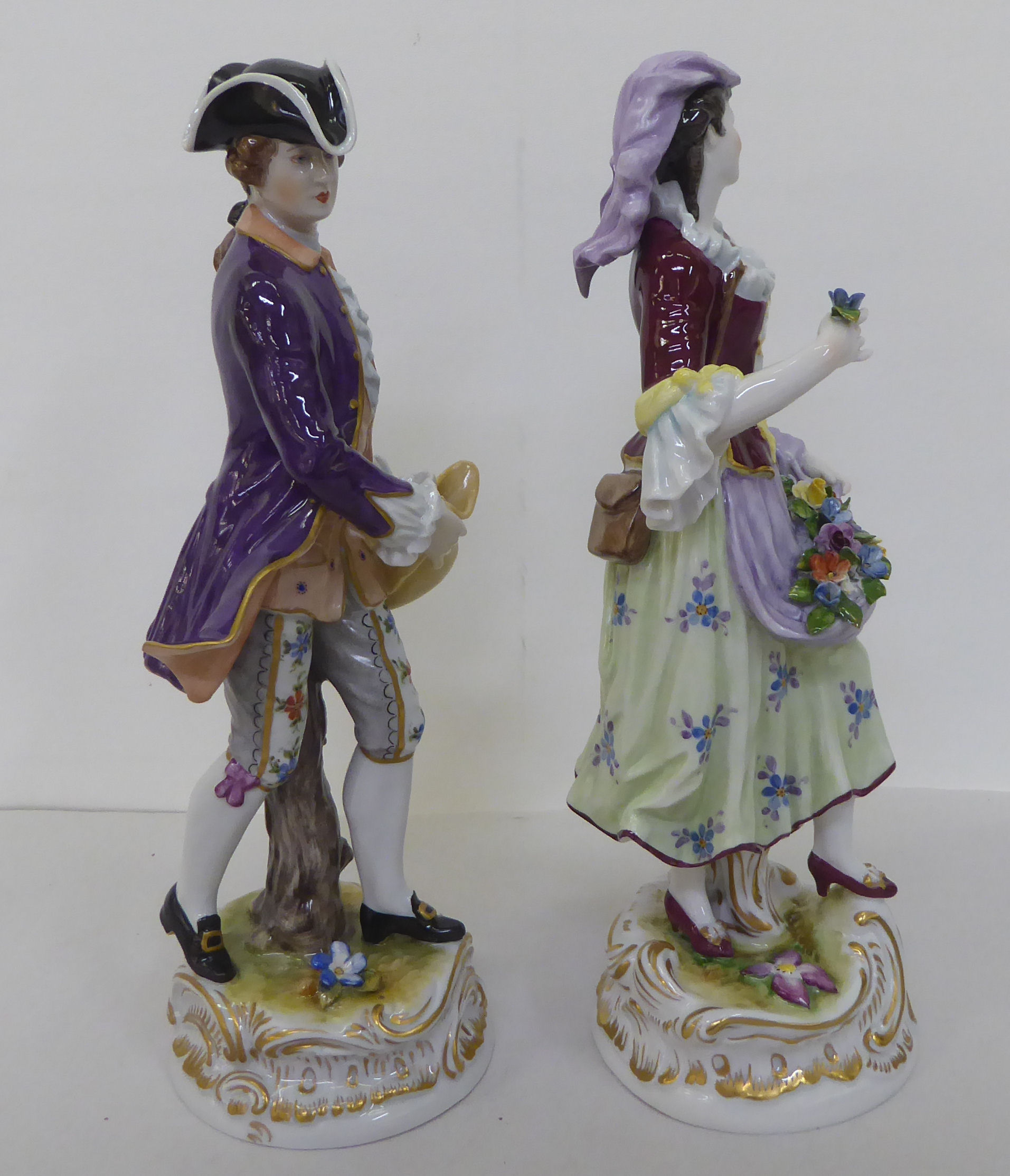 A pair of 20thC Continental porcelain figures, he wearing a tricorn hat and frockcoat, she with - Image 4 of 5