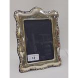 A silver mounted photograph frame, on a fabric easel back  modern Birmingham marks  4" x 6"