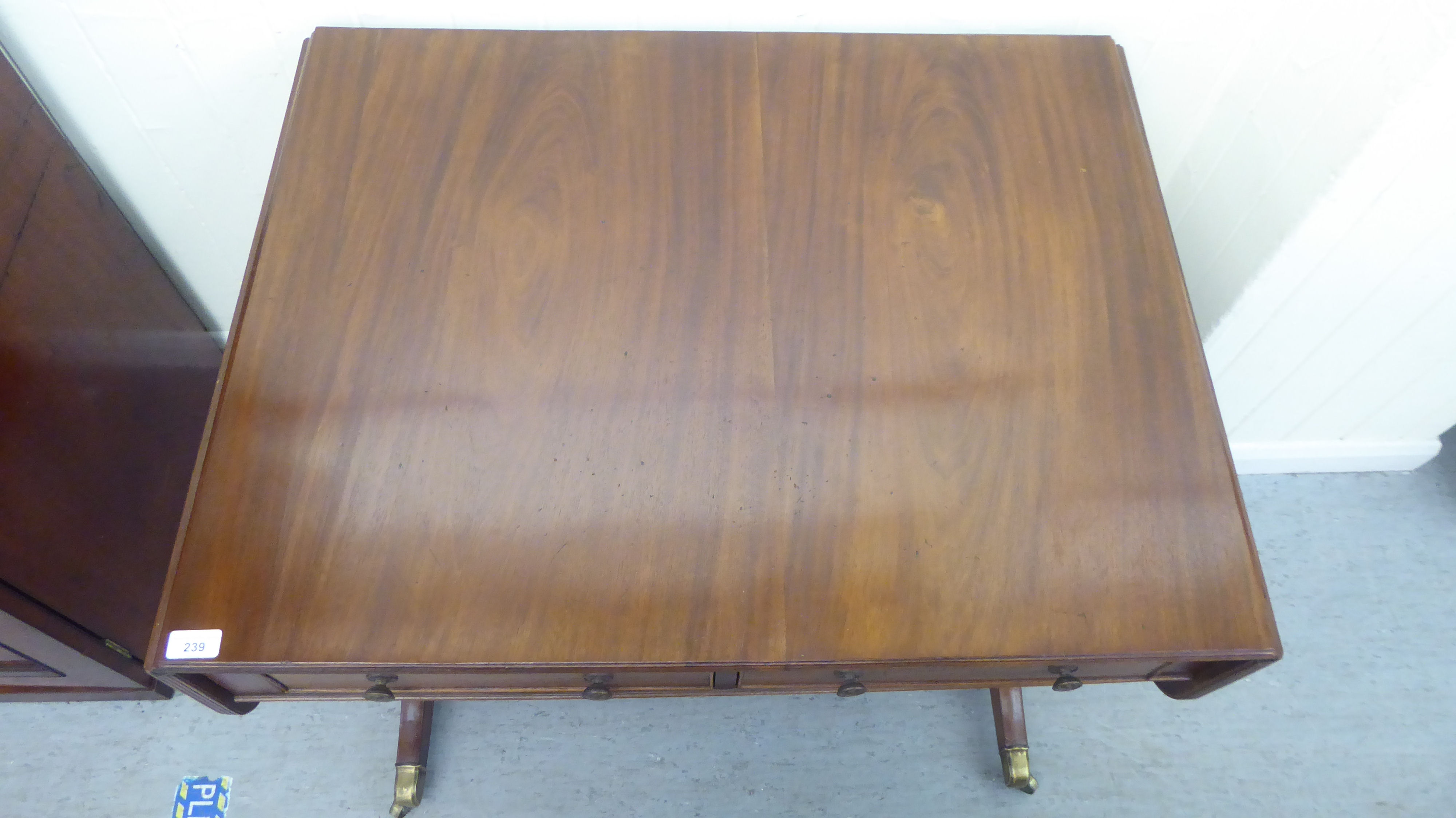 A late 19thC mahogany sofa table with two frieze drawers and two facsimiles on the obverse, raised - Image 2 of 3