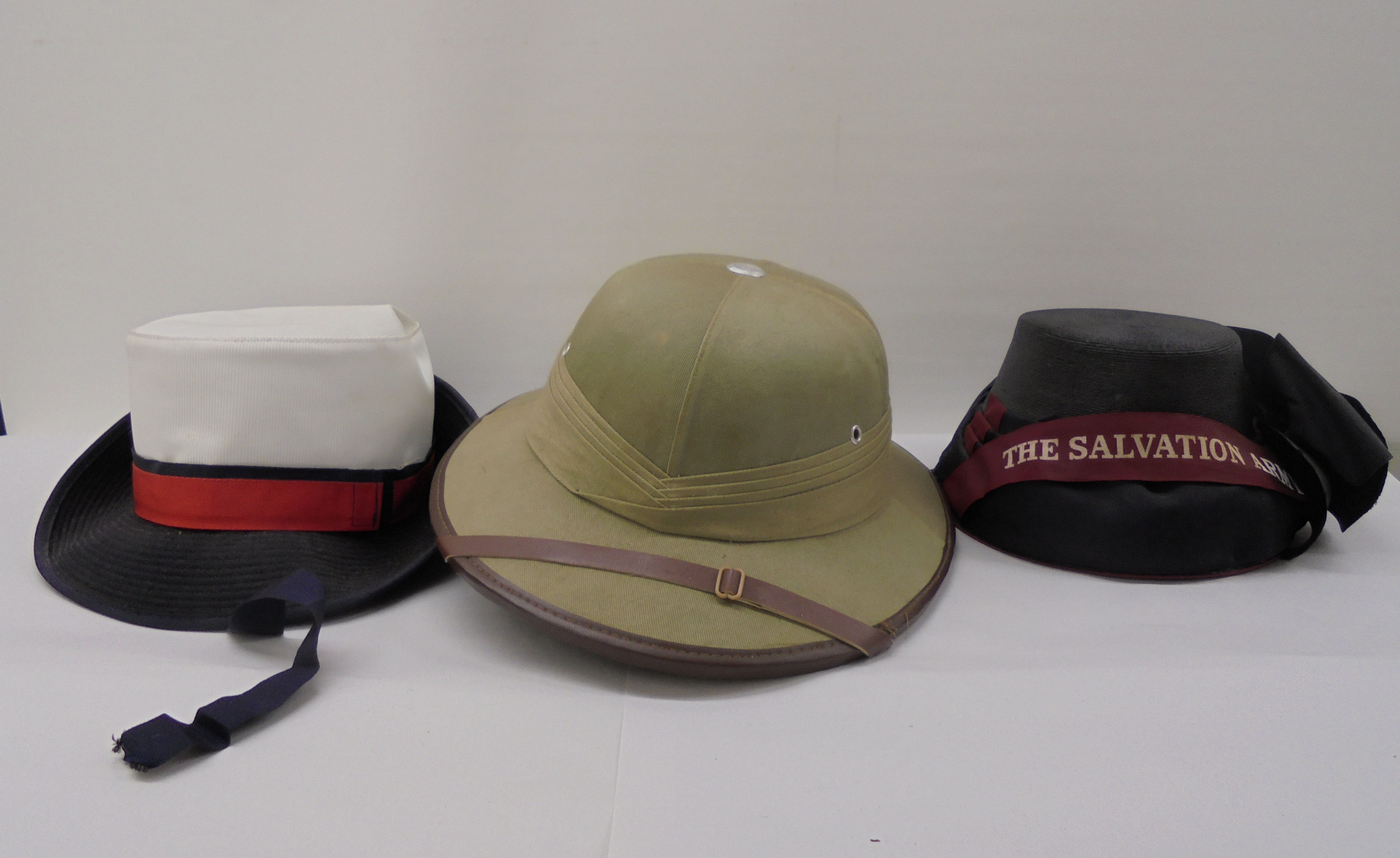 Three hats: to include a pith helmet