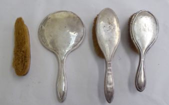 Silver backed dressing table items: to include a hand mirror  mixed marks