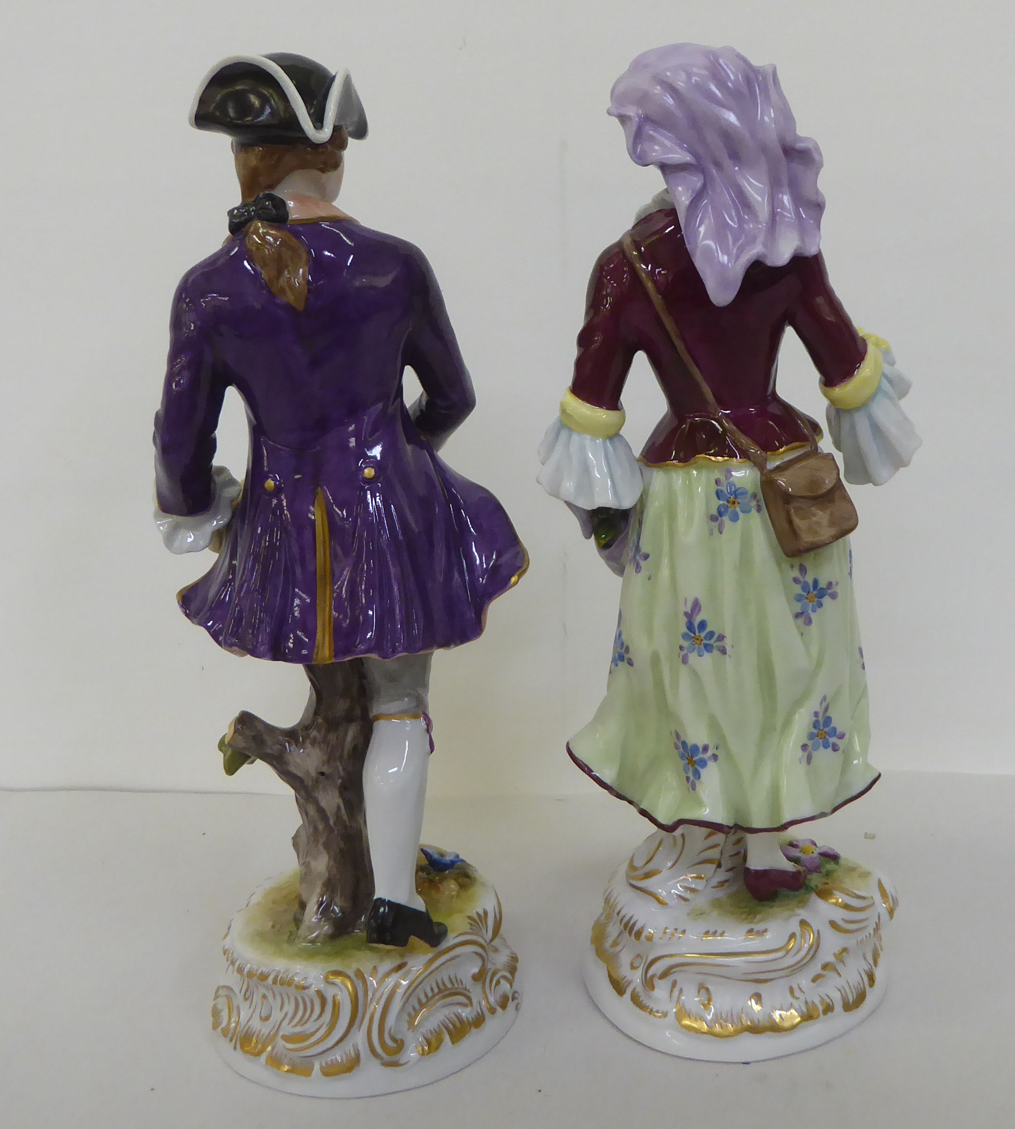 A pair of 20thC Continental porcelain figures, he wearing a tricorn hat and frockcoat, she with - Image 3 of 5