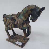 A mid 20thC pottery reproduction of a Chinese Tang Horse, on a rectangular plinth  9"h