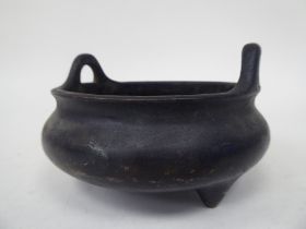 A 19th/20thC Chinese cast bronze censer with opposing upstand loop handles and a seal mark  5"dia