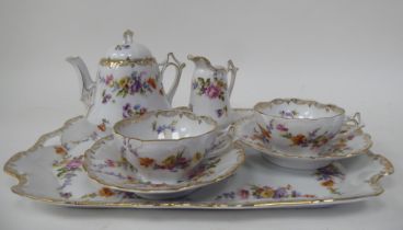 A Continental porcelain cabaret set, decorated with floral sprigs and gilding  comprising a