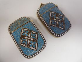 A pair of Norwegian silver gilt and coloured enamel vesta cases, one incorporating a strike plate