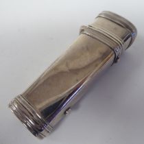 An early Victorian silver vesta case of tapered, rectangular form with a hinged cap on a button