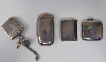 A late Victorian silver lozenge shape vesta case with a hinged cap, on a button clasp and strike