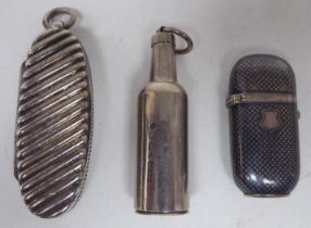 A late Victorian silver combination cylindrical pipe smokers tamper vesta case, on a suspension ring