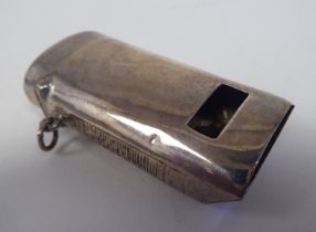 A late Victorian silver novelty vesta case, fashioned as a pea whistle with a hinged cap, strike