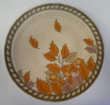 An early 20thC Crown Ducal Charlotte Rhead sponged, painted, gilded and tubeline pottery charger,