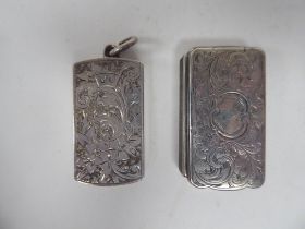 An early Victorian silver vesta case of box design with a hinged cap and bright-cut engraved