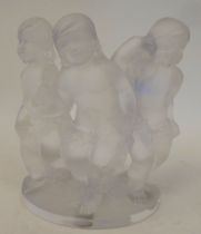 A Lalique 'Luxembourg' frosted crystal cherub trio group, on a semi-circular plinth  bears an etched
