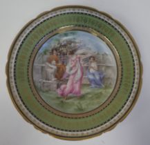 An Australian porcelain dish with a shallow centre and wide, wavy rim, decorated in colours with a