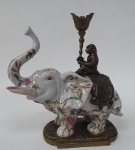 A modern Oriental china and bronze mounted model, a floral decorated trumpeting elephant with a