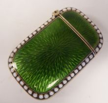 A Norwegian silver gilt and coloured enamel vesta case with a hinged strike plate and cap and bead