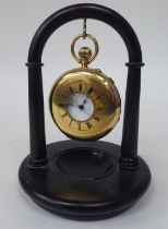 An 18ct gold cased half-hunter pocket watch with black enamel Roman numerals around the bullseye