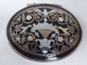 A Georgian silver oval snuff box with a hinged lid and tortoiseshell panels, inlaid in bi-coloured