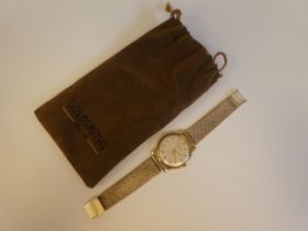 A 14ct gold International Watch Co. bracelet wristwatch, faced by a baton dial with sweeping