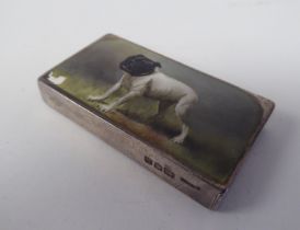 A late Victorian silver and coloured enamel vesta case of rectangular design with a hinged cap and
