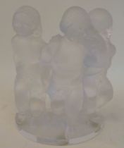 A Lalique 'Luxembourg' frosted crystal cherub trio group, on a semi-circular plinth  bears an etched