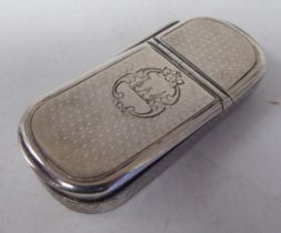 An early Victorian silver lozenge shape, engine turned vesta case with twin hinged flaps and a