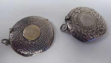 An Edwardian silver disk design vesta case with bright cut floral engraving, a hinged cap, strike