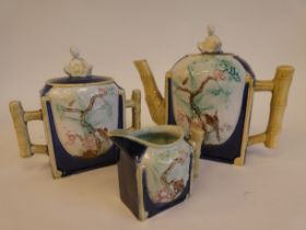 An 19thC English majolica three piece tea set in Anglo-Chinese taste, decorated with moulded