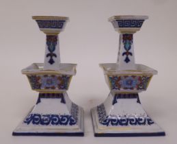 A pair of mid 19thC Royal Worcester porcelain candlesticks of tapered, square outline, decorated