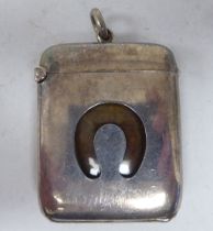 A late Victorian silver vesta case, incorporating a strike plate, hinged cap and sprung flap with