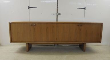 Attributed to Gordon Russell, a rosewood sideboard, comprising four inline, full-height doors,