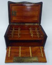 A 19thC black lacquered and gilded metal, serpentine front desktop humidor, finely decorated by