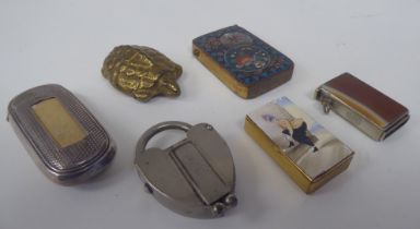 Six novelty white metal, brass and other vesta cases, variously incorporating strike plates: to