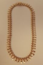 An 18ct gold tasselled pendant link necklet, on a bayonet clasp