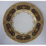 A Royal Doulton porcelain plate, finely decorated in midnight blue enamel and gilding  10.5"dia