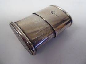 A mid Victorian silver vesta case of oval form with a slide drawer and strike plate  HWD  London