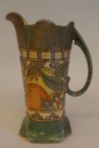 A Bursley Ware Charlotte Rhead pottery jug of panelled form with a castellated rim and loop