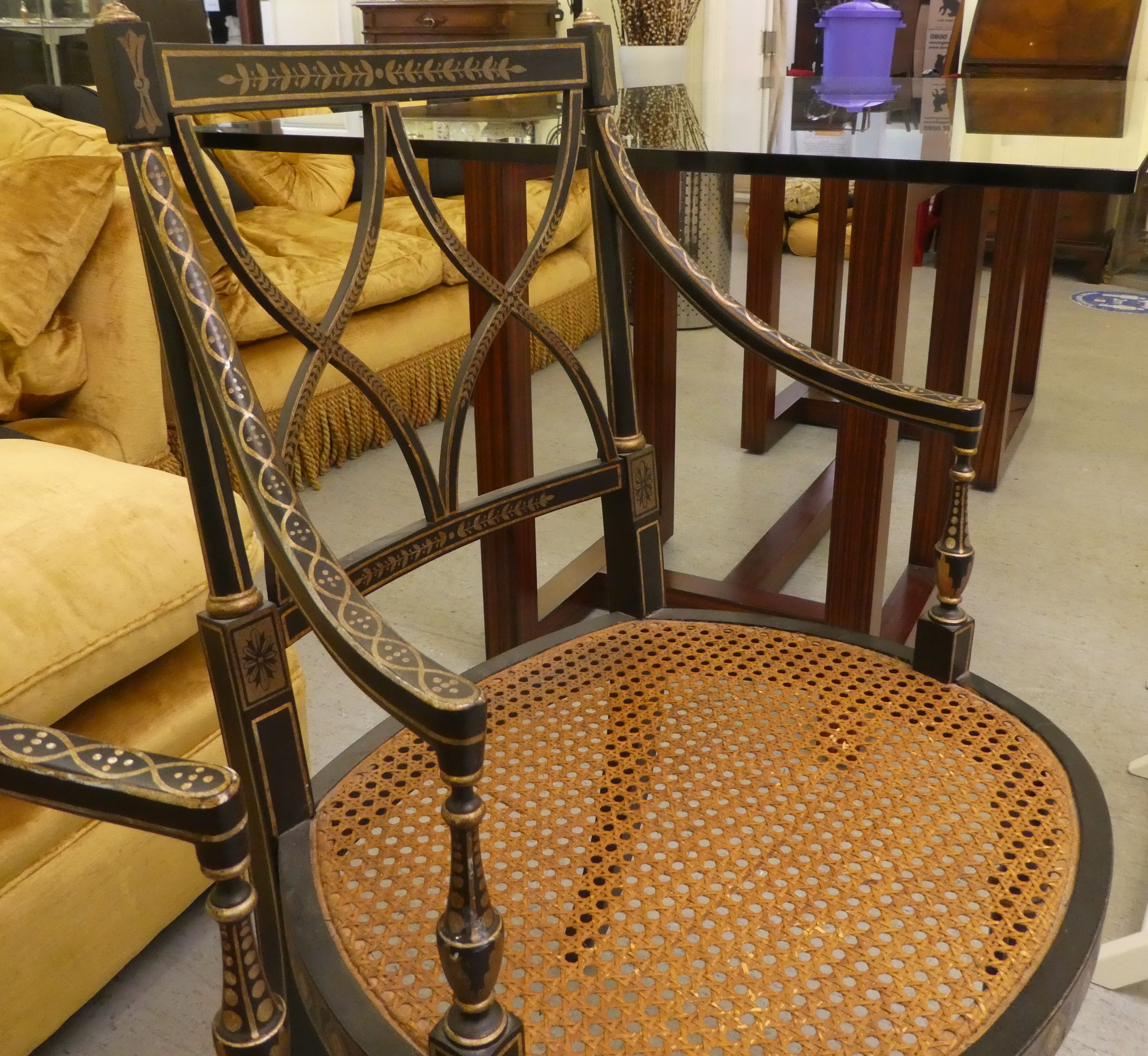 A pair of early 19thC style black painted and gilded beech framed chairs, each having a curved - Image 5 of 6